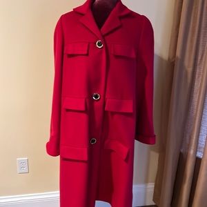 100% wool. Heavy few worn spots.  On bottom lapel. And under where coat buttons